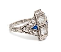 An Art Deco Platinum, Diamond and Sapphire Ring, 1.90 dwts.