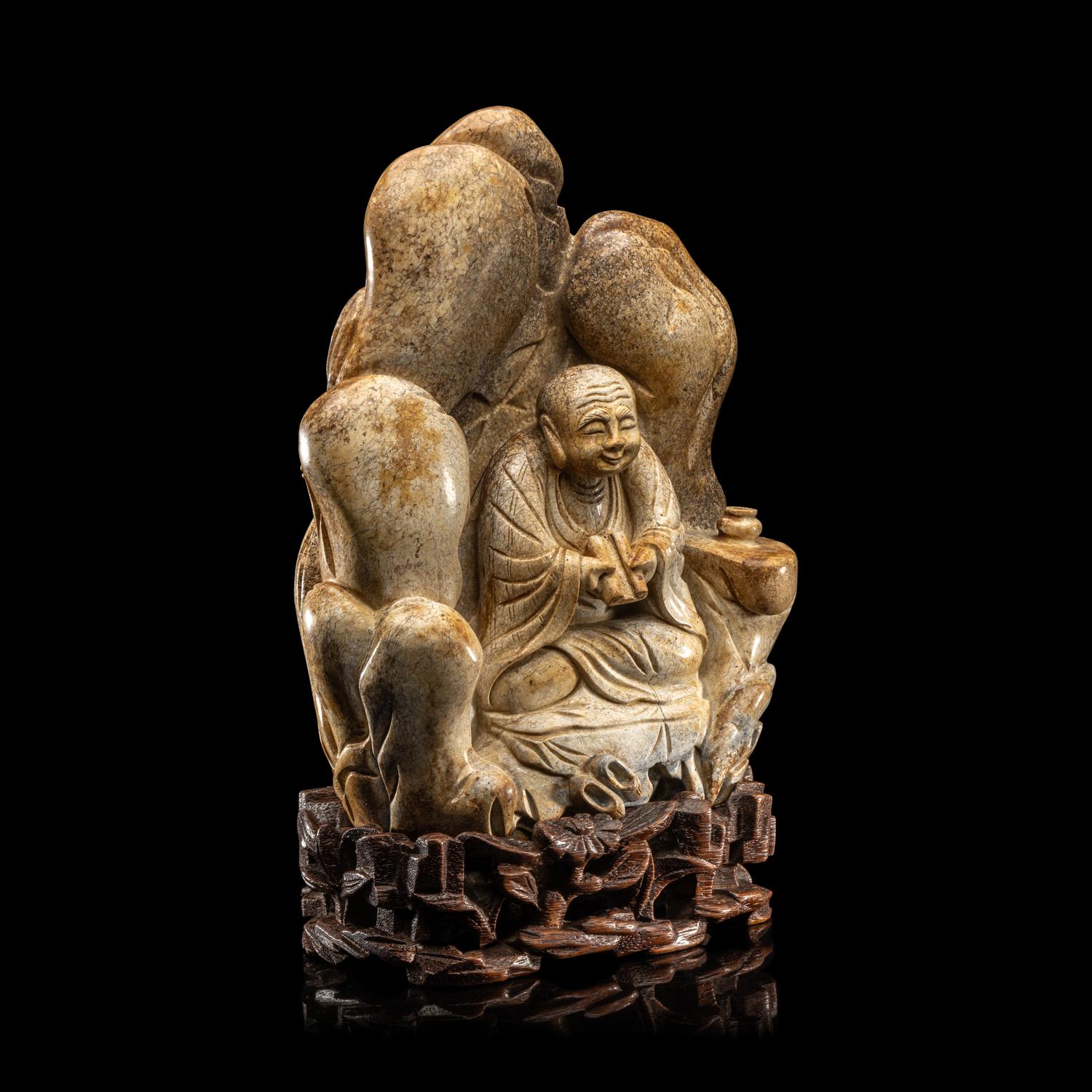 A Chinese Burnt Jade 'Luohan' Boulder 火燒玉羅漢山子