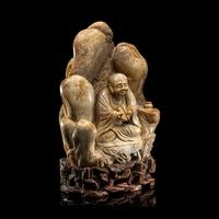 A Chinese Burnt Jade 'Luohan' Boulder 火燒玉羅漢山子