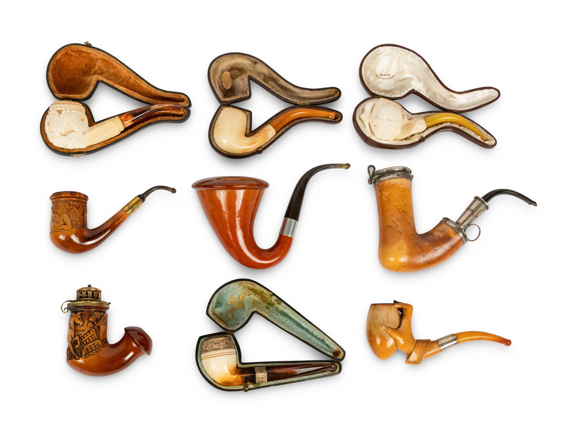 A Group of Nine Carved Meerschaum and Wooden Pipes