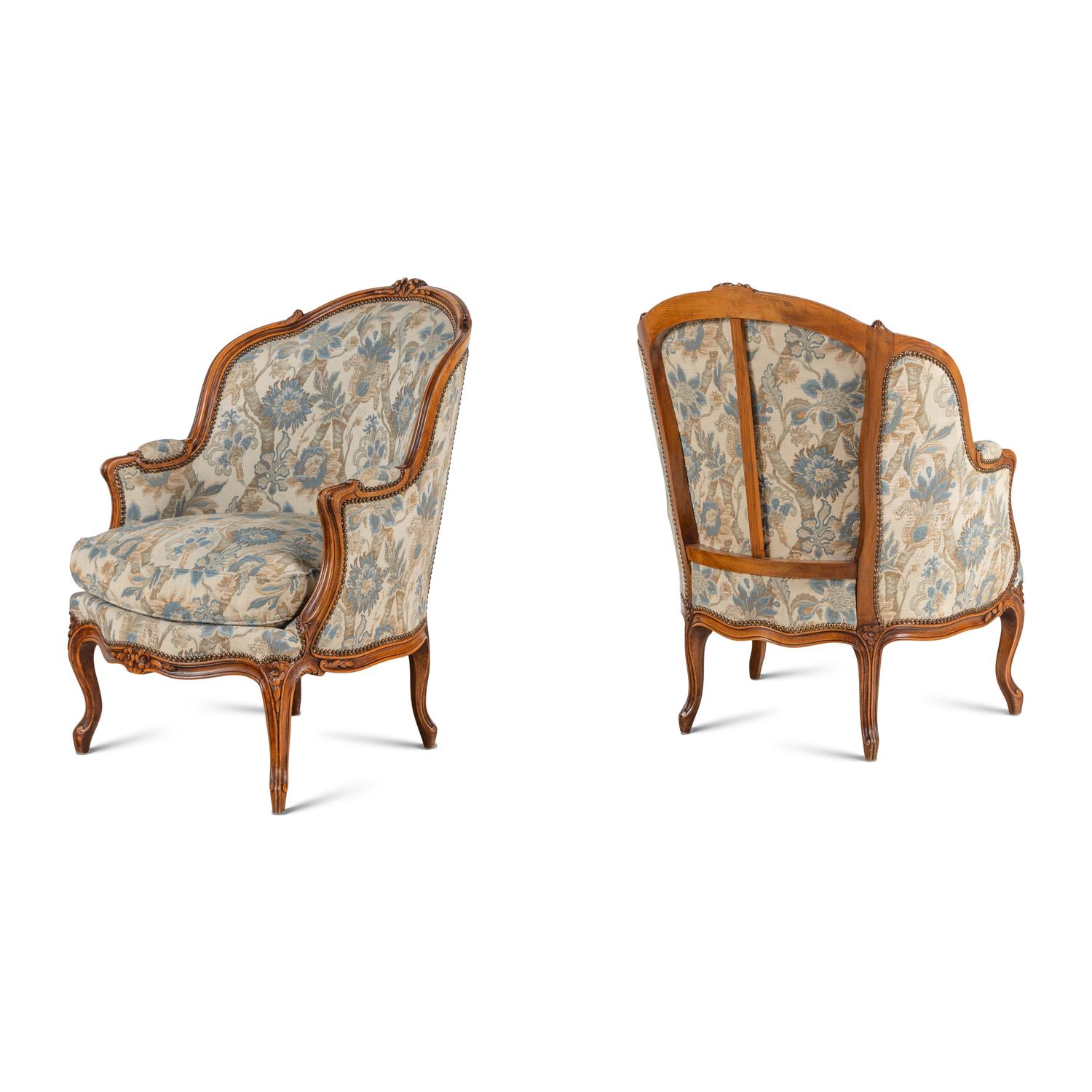 A Pair of Louis XV Style Walnut Bergères
