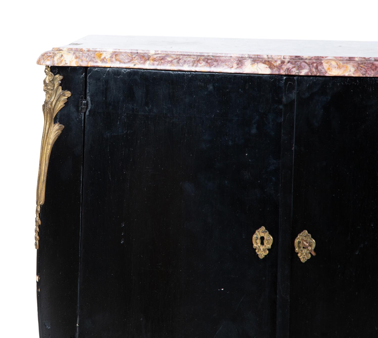 A Transitional Louis XV/XVI Style Gilt Bronze Mounted Ebonized Marble-Top Commode