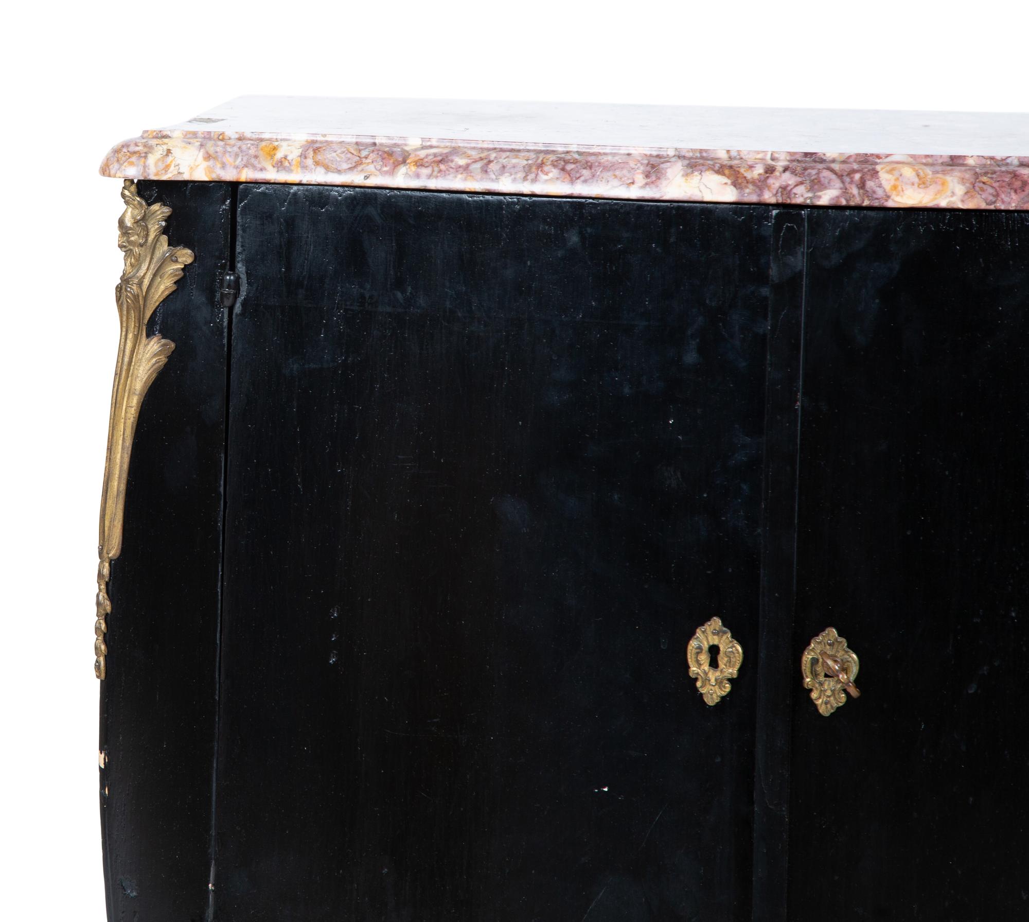 A Transitional Louis XV/XVI Style Gilt Bronze Mounted Ebonized Marble-Top Commode