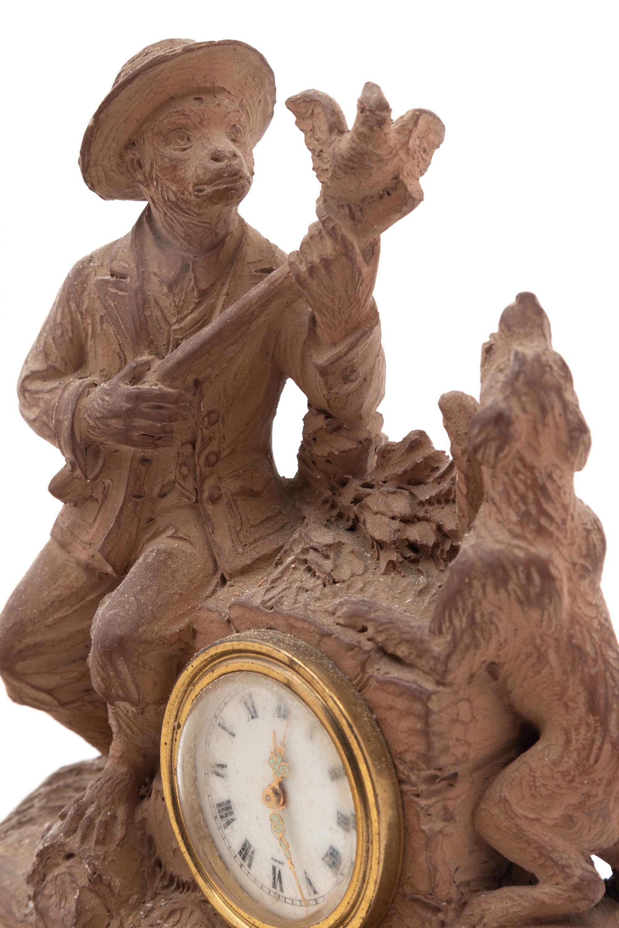 A Continental Terra Cotta Figural Clock