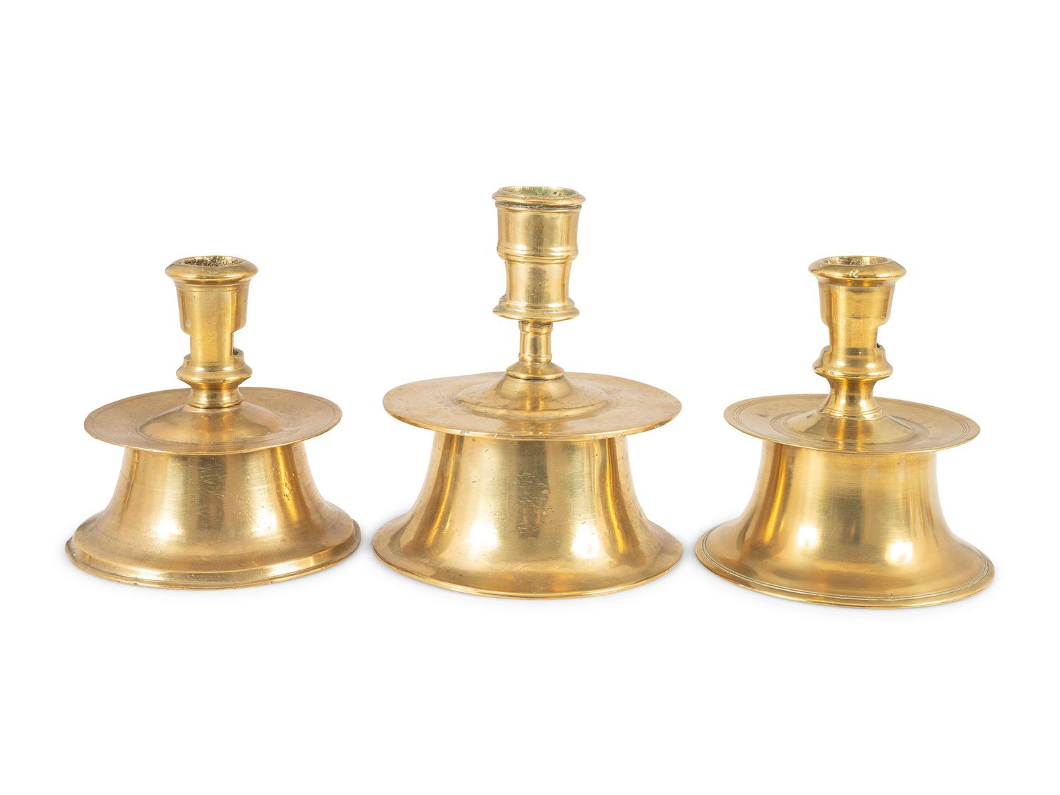 Three Continental Brass Capstan Candlesticks