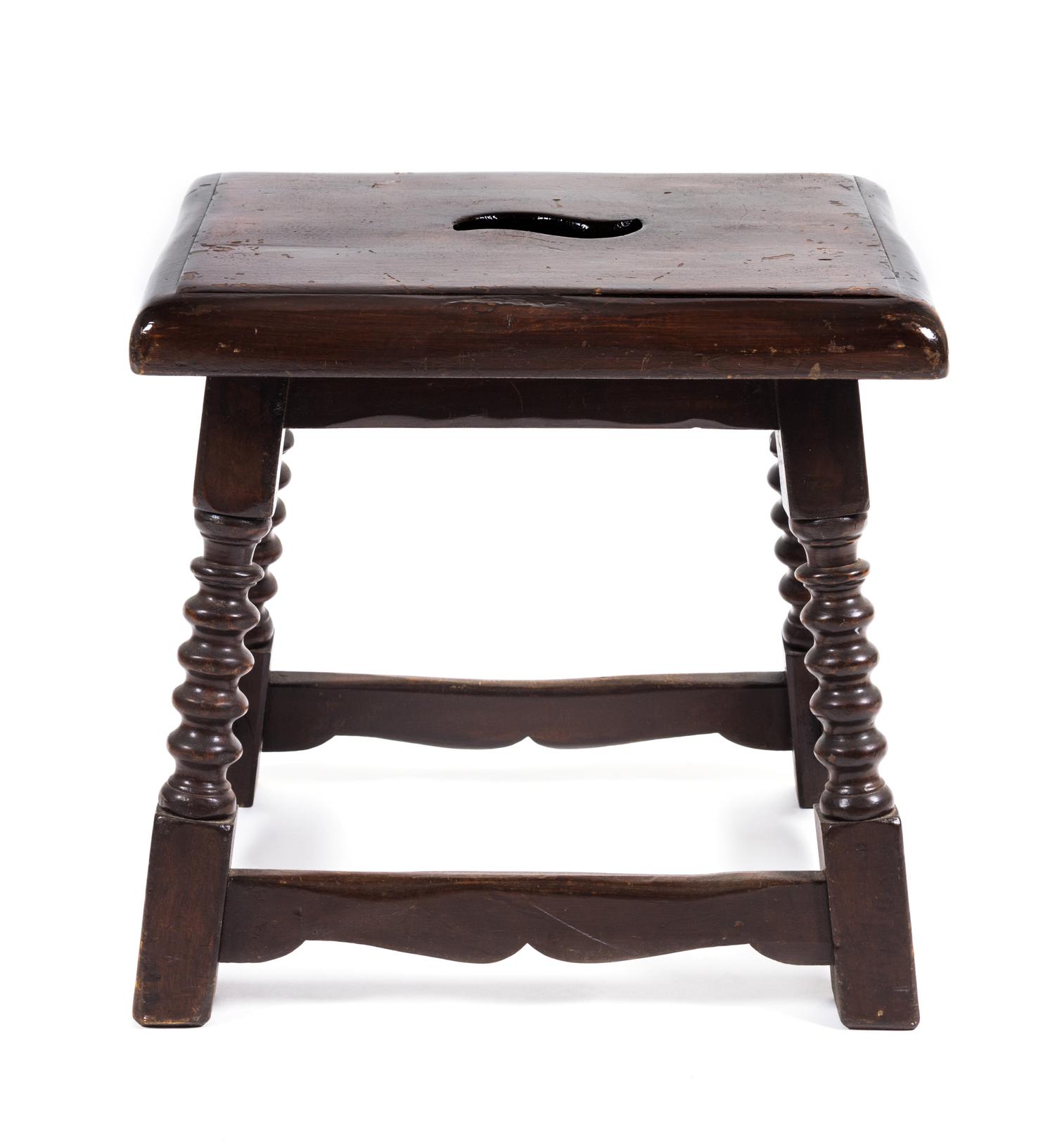 A Jacobean Style Walnut Stool Height 17 x width 17 1/2 x depth 14 inches.