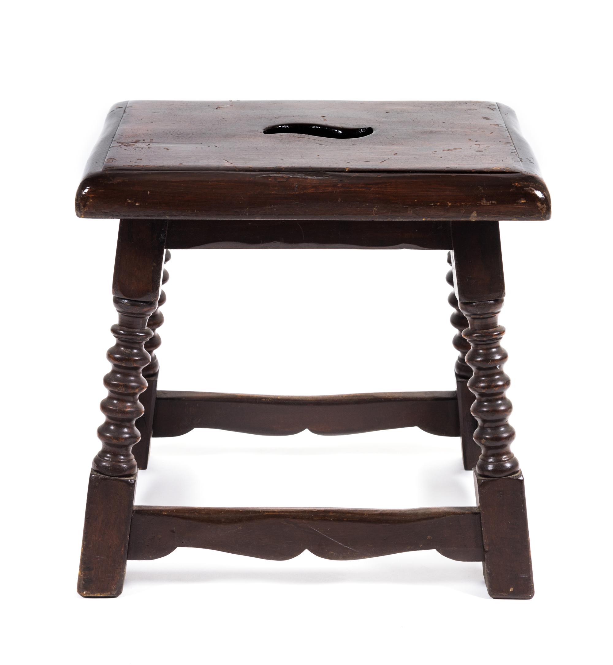 A Jacobean Style Walnut Stool Height 17 x width 17 1/2 x depth 14 inches.
