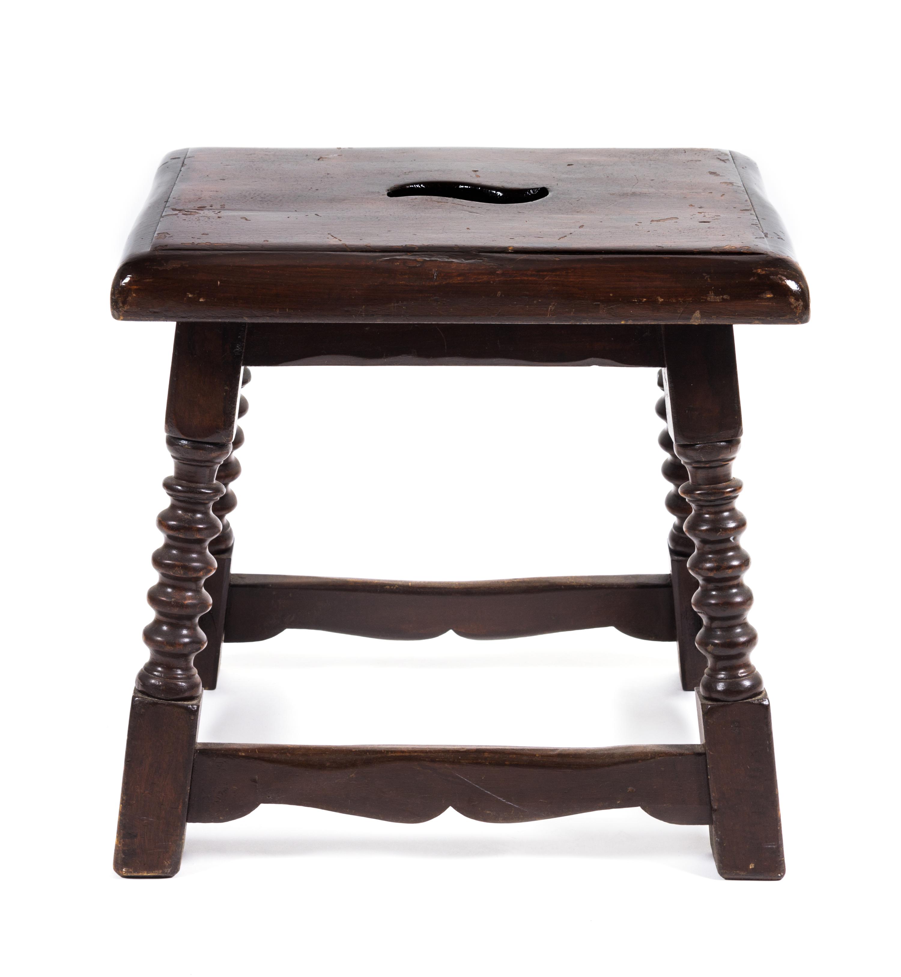 A Jacobean Style Walnut Stool Height 17 x width 17 1/2 x depth 14 inches.