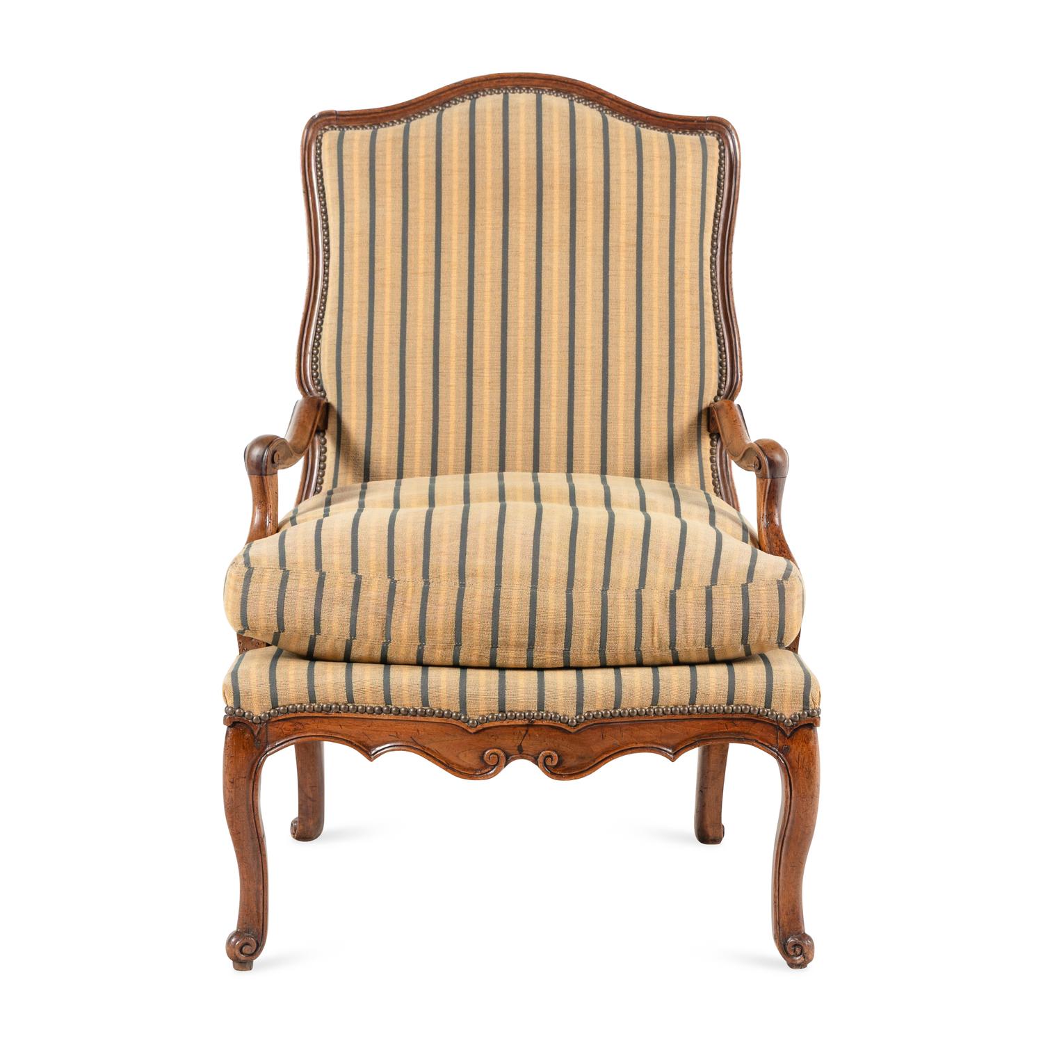 A Louis XV Carved Walnut Fauteuil