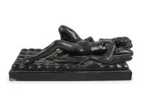 A Cast Bronze Figure of a Reclining Nude Woman