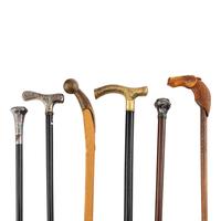 A Collection of Six Gentleman's Walking Sticks with Stand