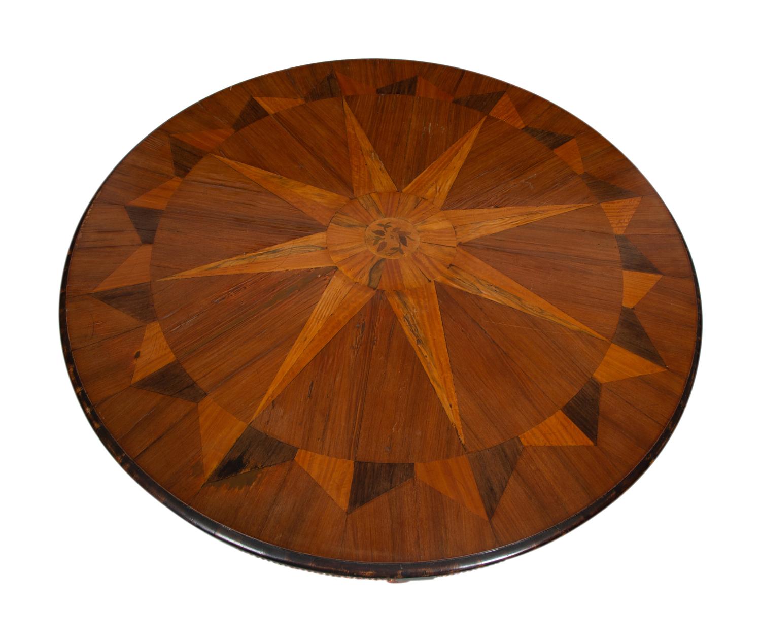 An Italian Parquetry, Ebonized and Parcel Gilt Extending Dining Table