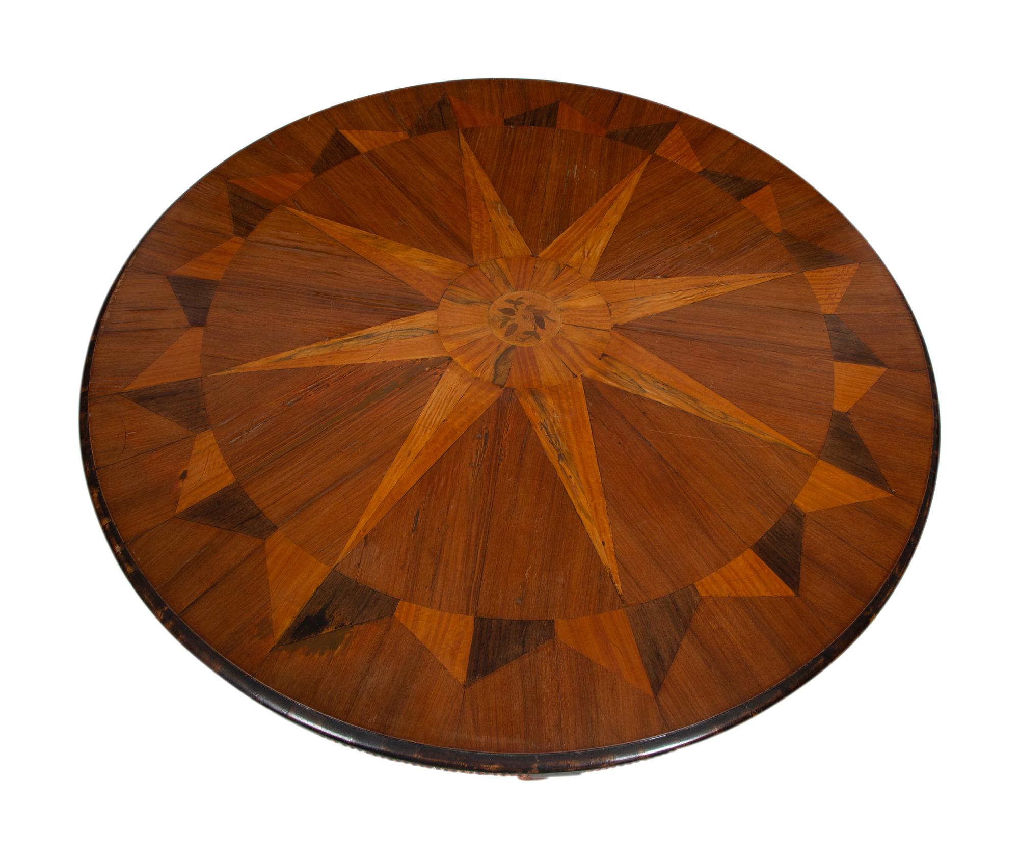 An Italian Parquetry, Ebonized and Parcel Gilt Extending Dining Table