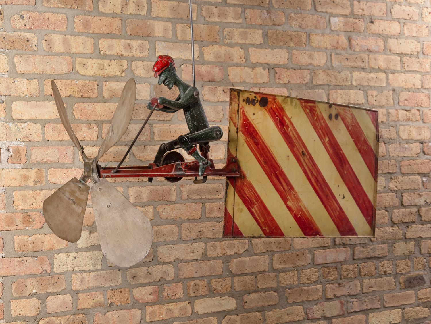 A Cast Iron and Sheet Copper Cycling Automoton Whirligig