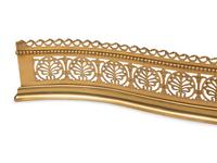 An Irish Pierced Brass Serpentine Fire Fender