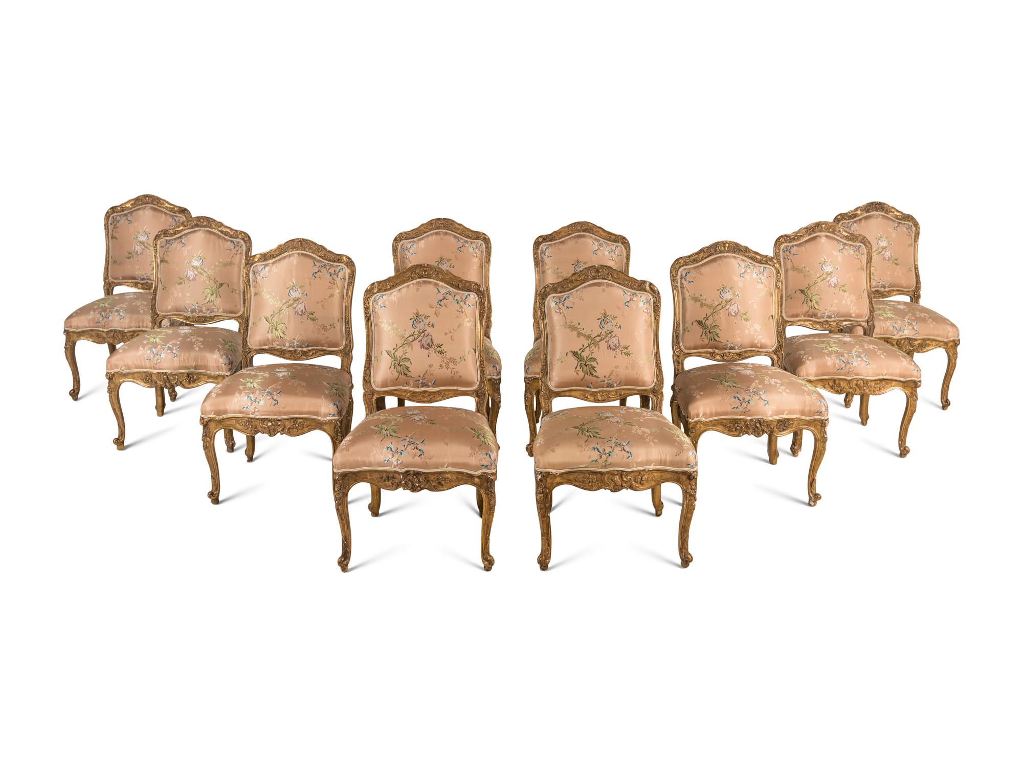 A Set of Ten Régence Style Giltwood Dining Chairs