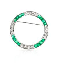 A Platinum, Diamond, and Emerald Circle Brooch, 4.40 dwts.