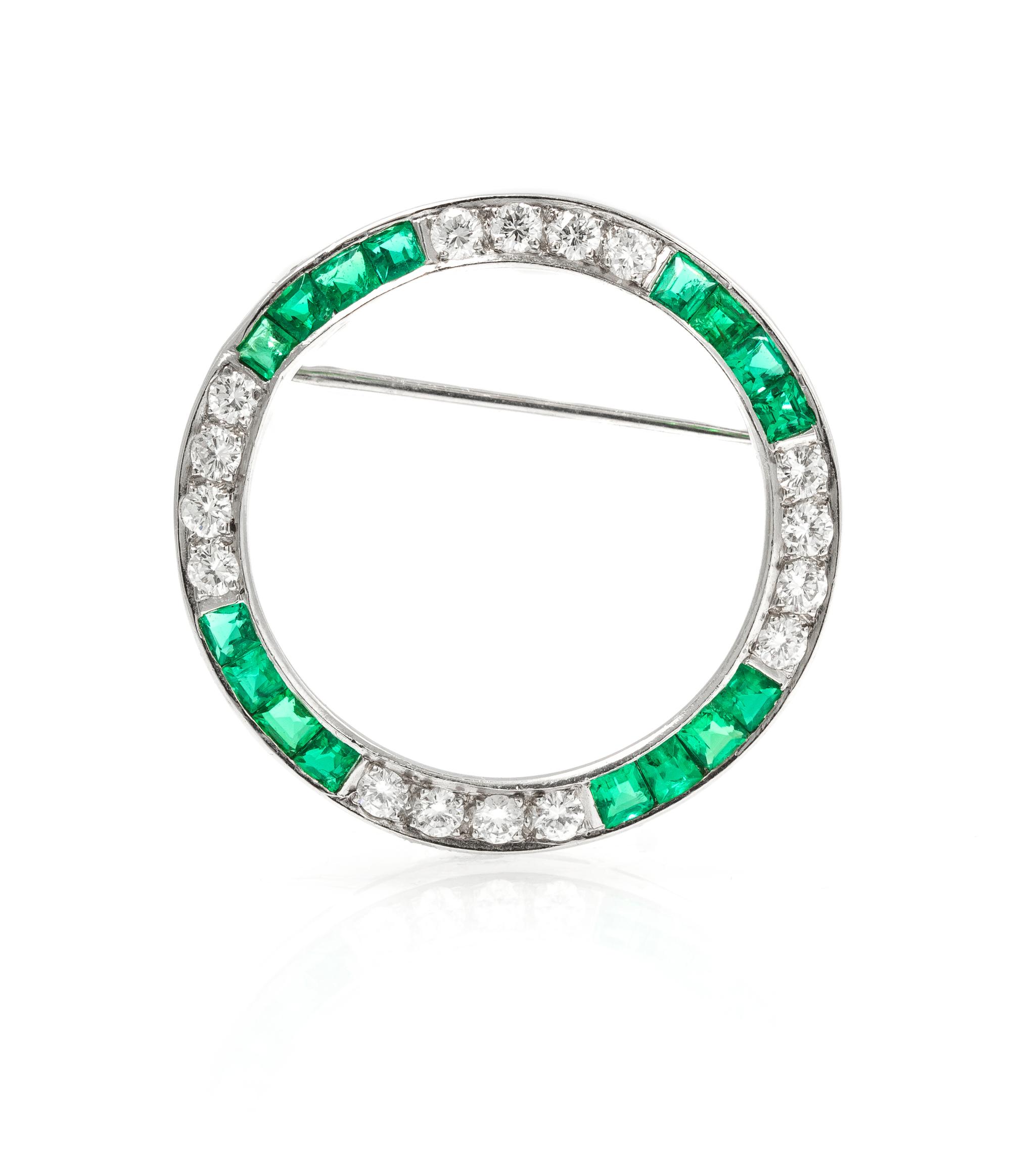 A Platinum, Diamond, and Emerald Circle Brooch, 4.40 dwts.