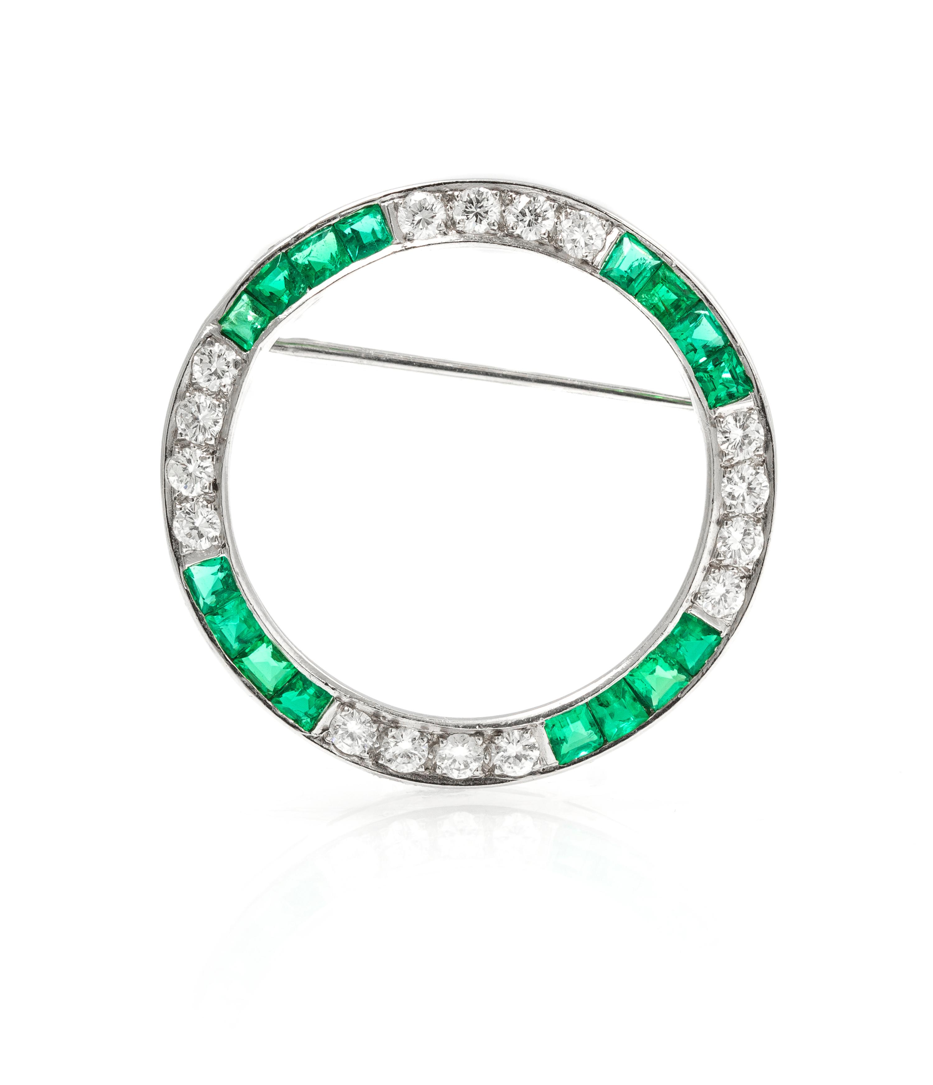 A Platinum, Diamond, and Emerald Circle Brooch, 4.40 dwts.