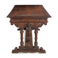 An Italian Carved Walnut Library Table