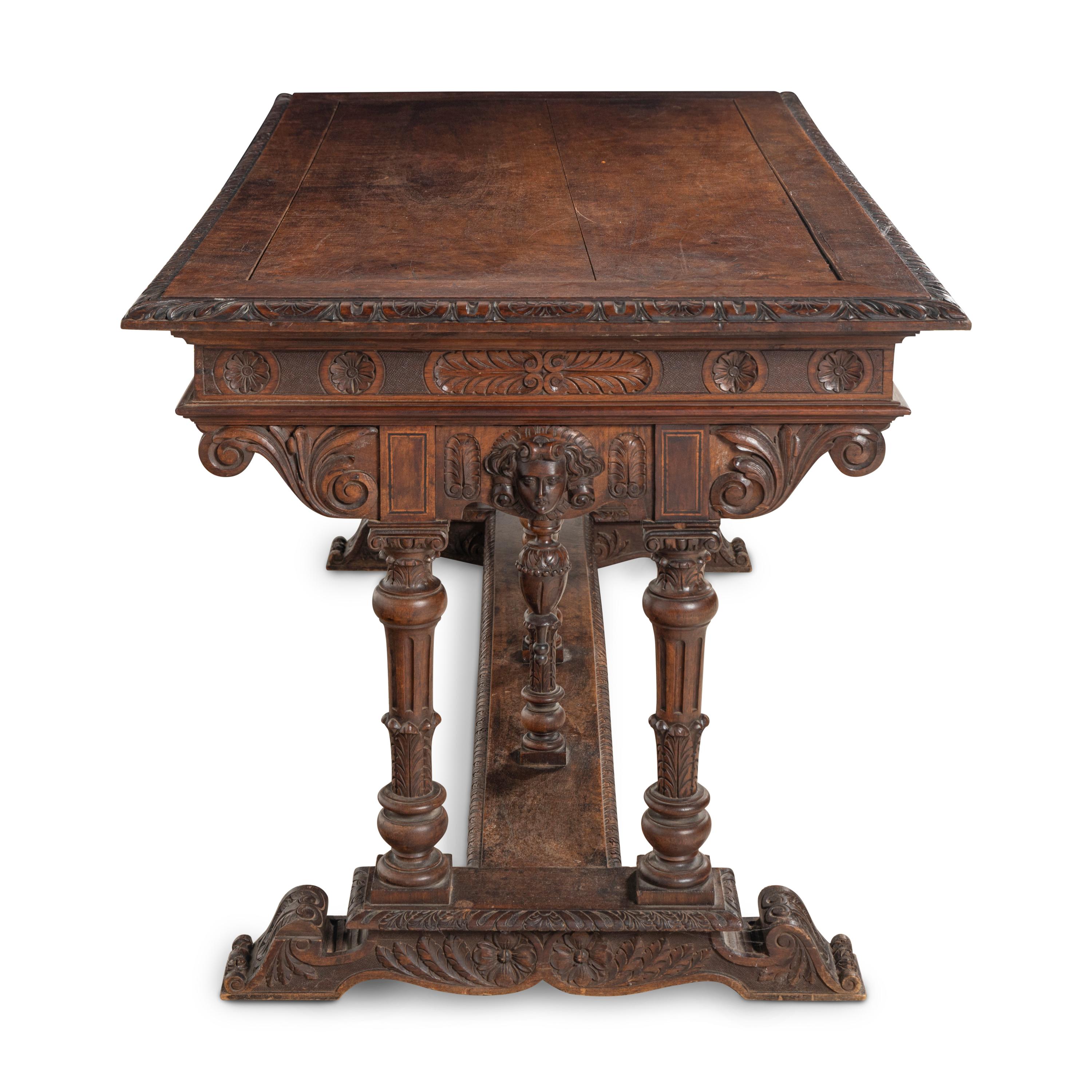 An Italian Carved Walnut Library Table