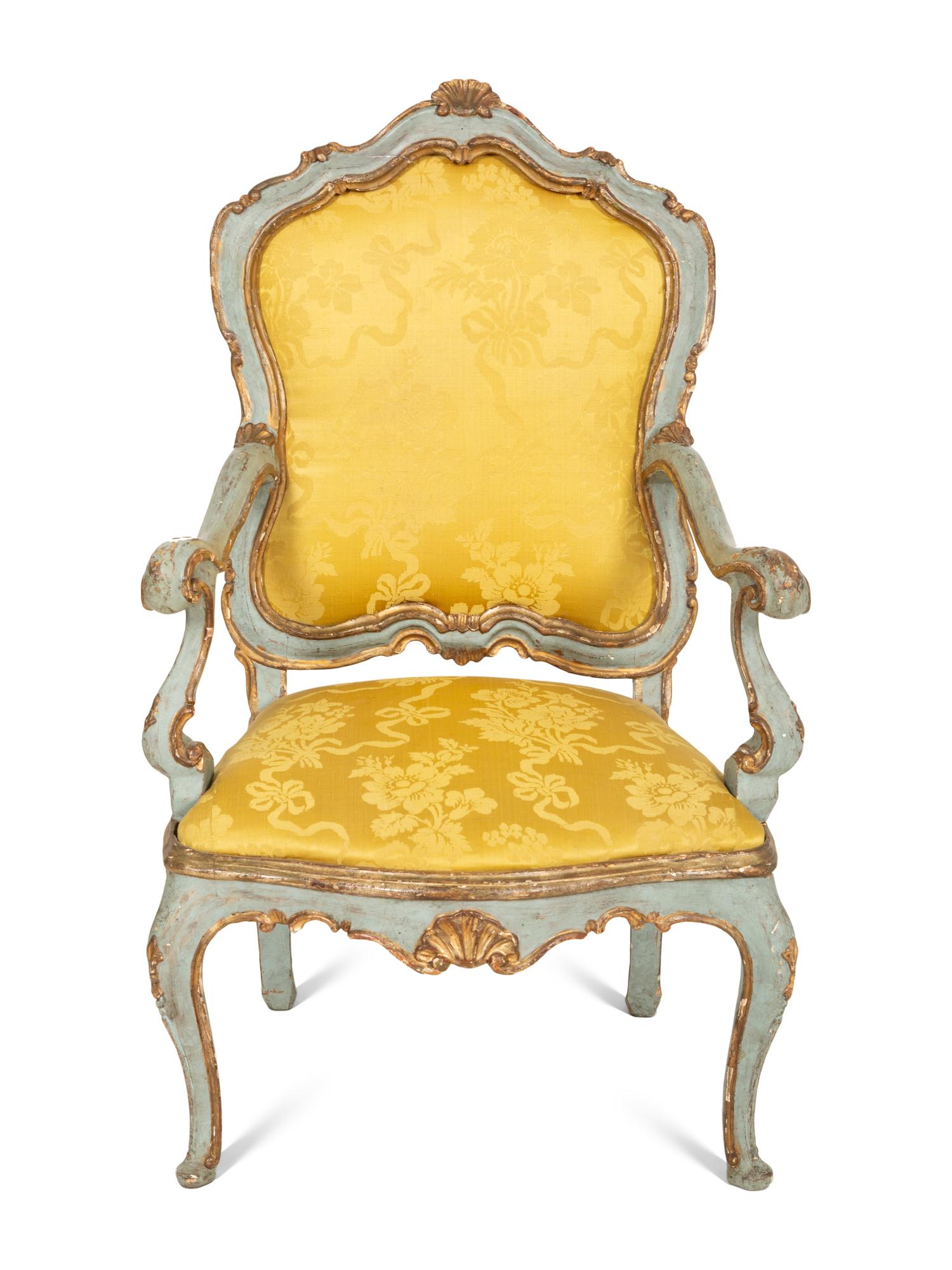 An Italian Rococo Painted and Parcel Gilt Open Armchair