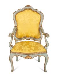 An Italian Rococo Painted and Parcel Gilt Open Armchair