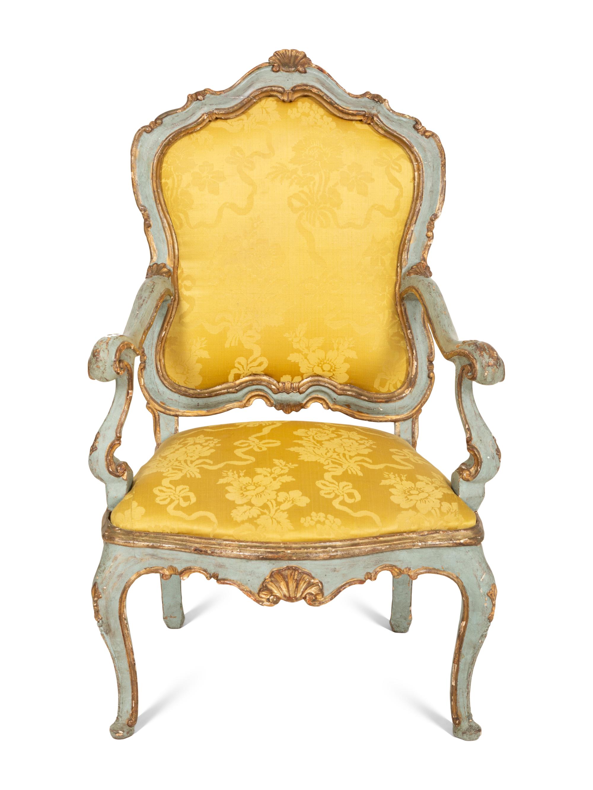 An Italian Rococo Painted and Parcel Gilt Open Armchair