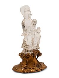 A Carved Rock Crystal Figure of Guanyin on a Giltwood Base