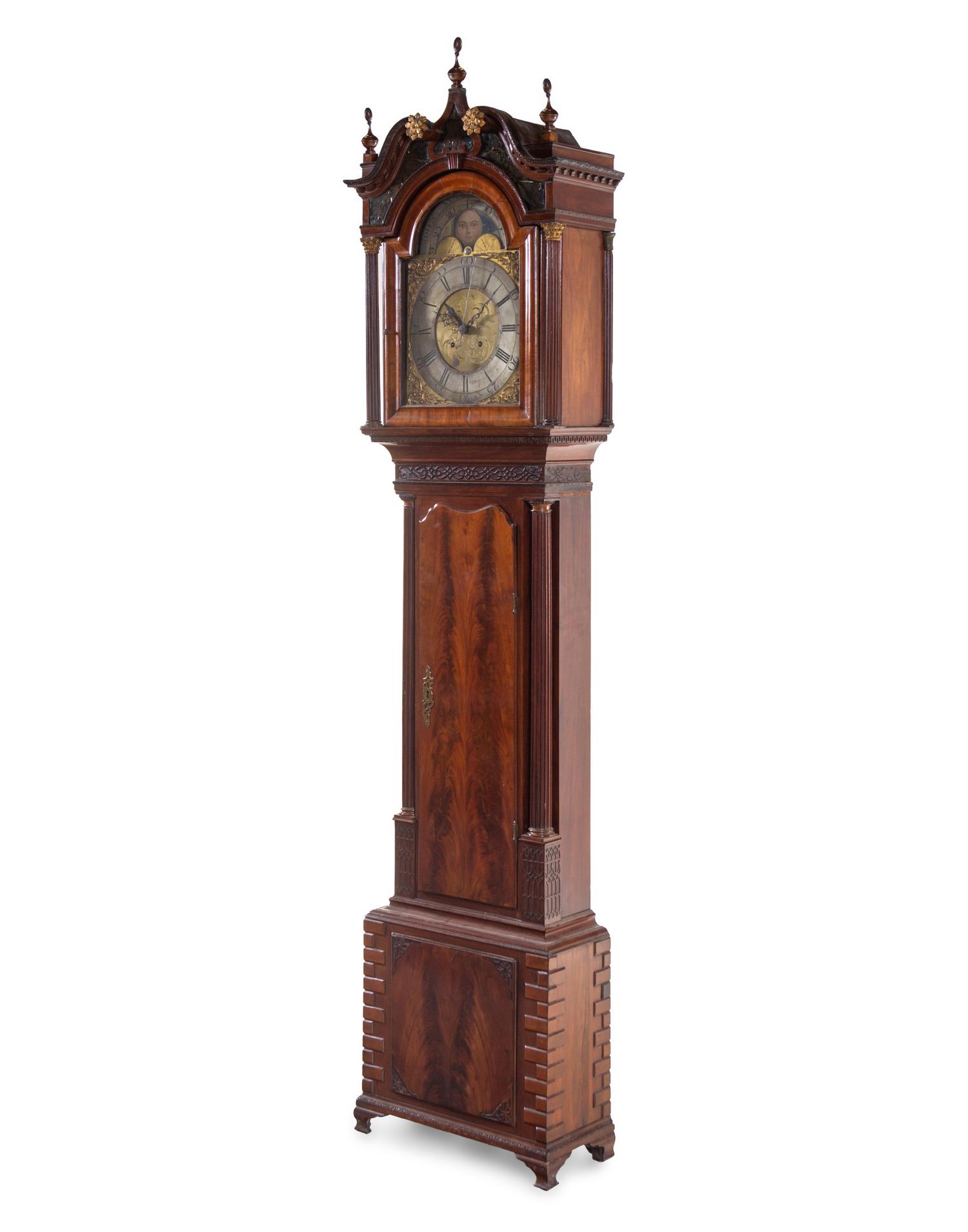 A George III Carved and Figured Mahogany Tall Case Clock