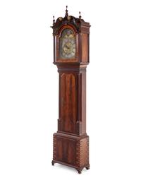 A George III Carved and Figured Mahogany Tall Case Clock