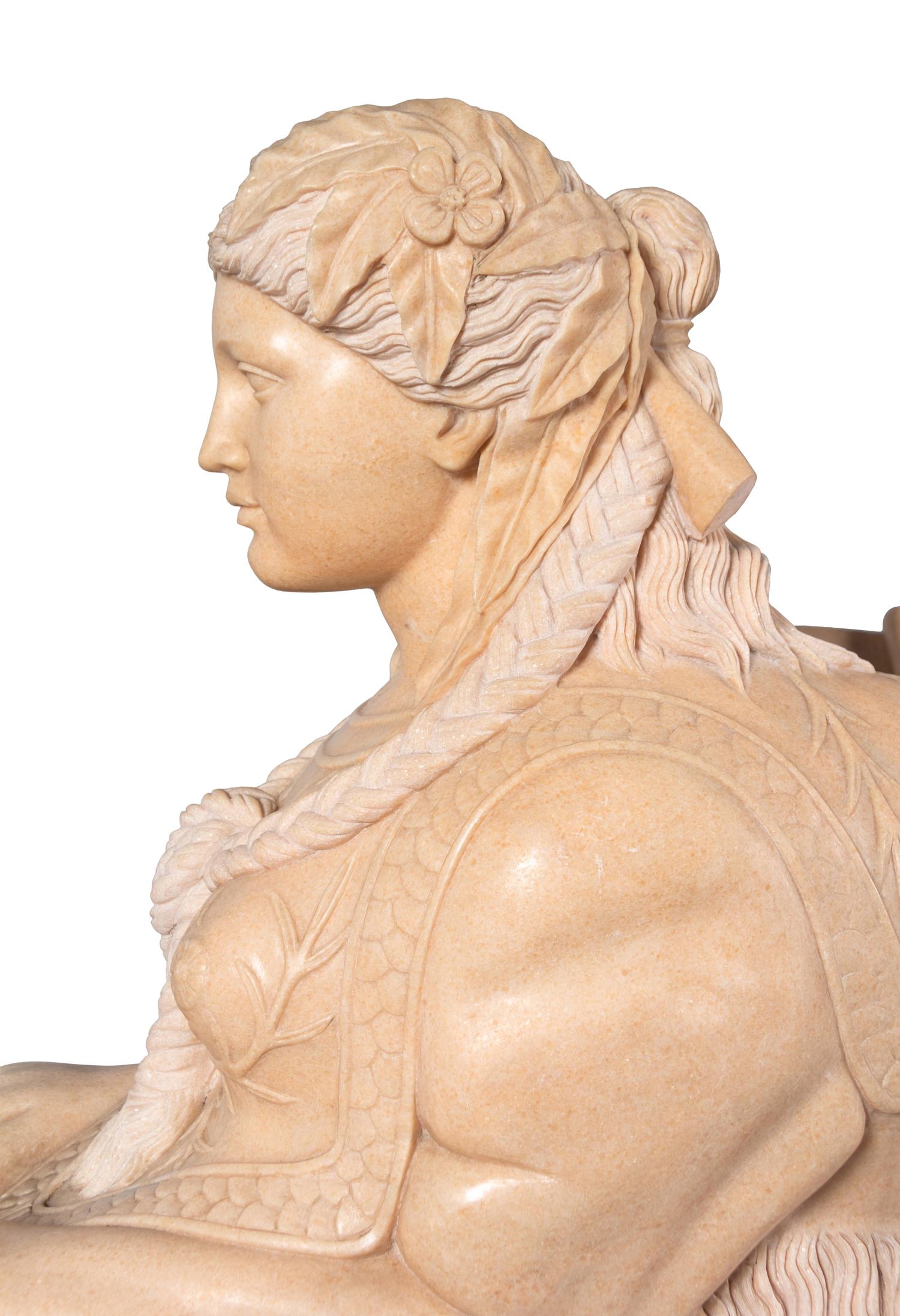 A Pair of Large Composite Marble Sphinxes