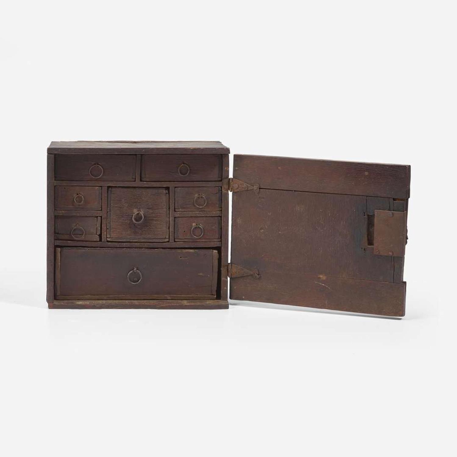 A Charles I carved oak wall-hanging spice cupboard circa 1650