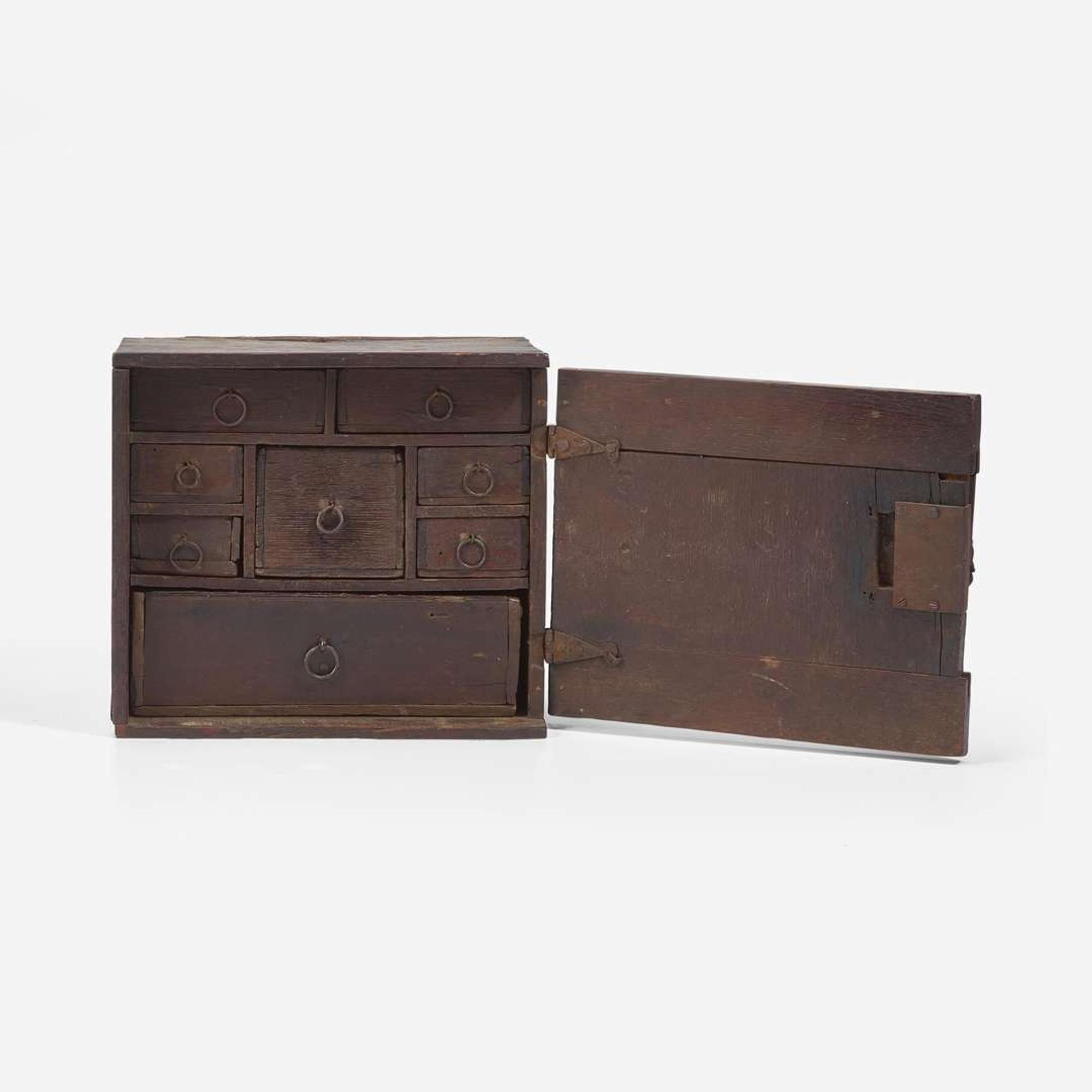 A Charles I carved oak wall-hanging spice cupboard circa 1650