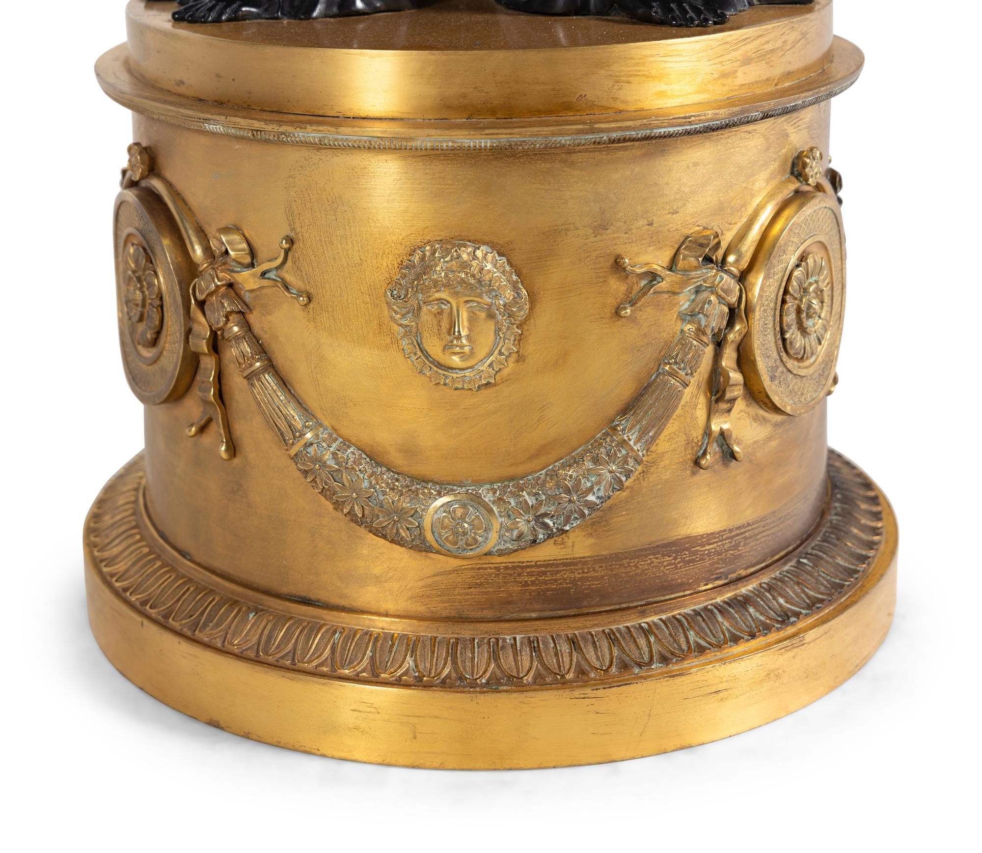 A Pair of Empire Style Gilt and Patinated Bronze Figural Centerpieces