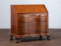 A Chippendale Carved Mahogany Reverse Serpentine Block-Front Desk