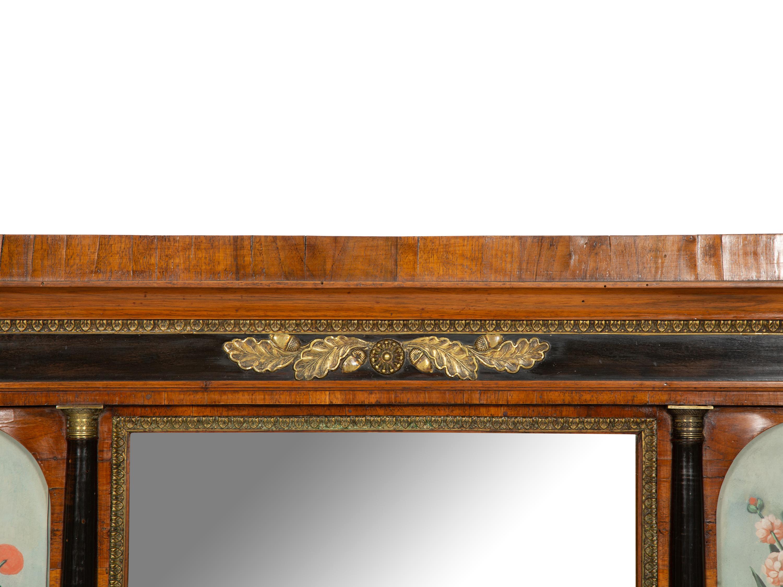 A North Italian Ebonized and Gilt Metal Mounted Walnut Overmantel Mirror