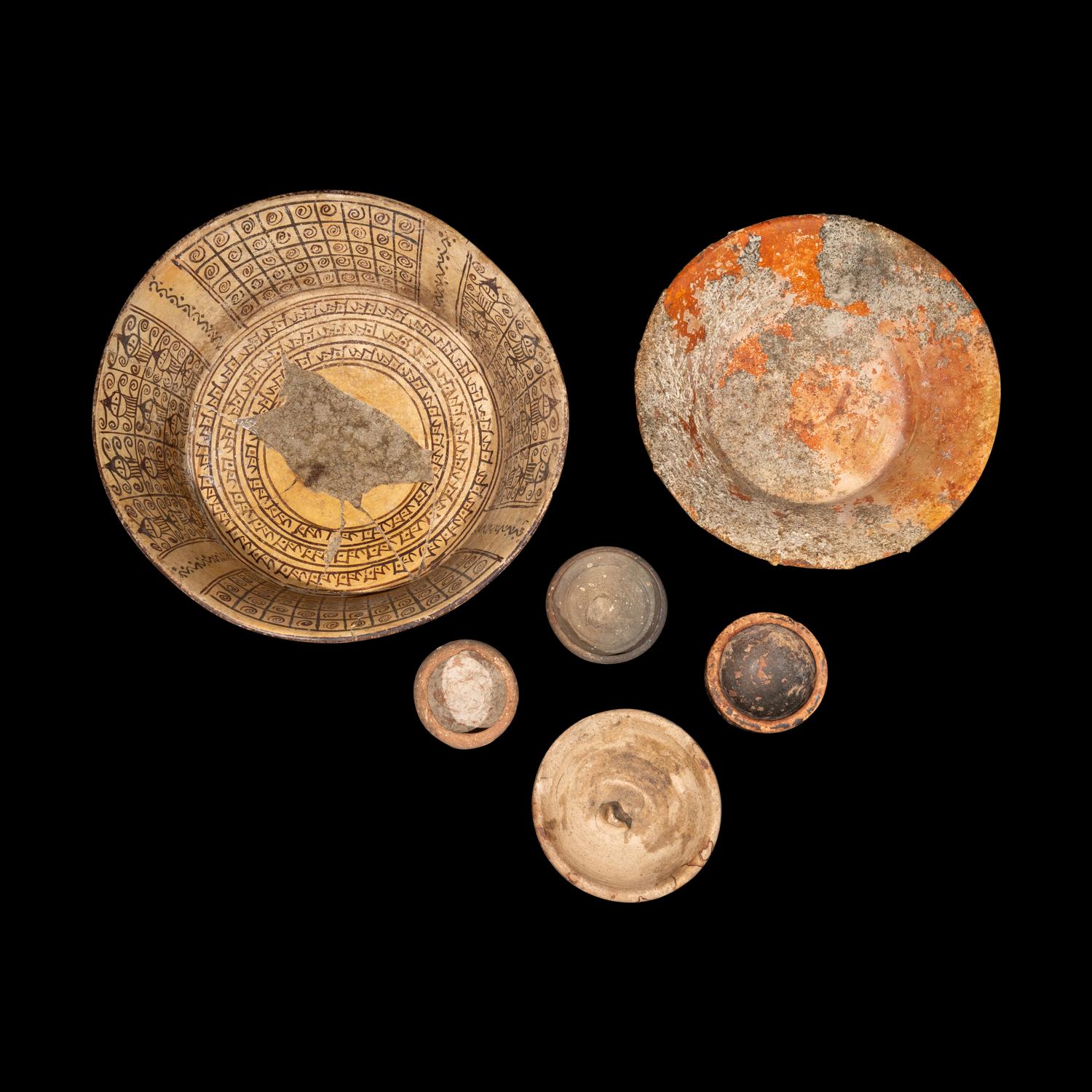 Eight Western Asiatic and Greco-Roman Terracotta, Alabaster, and Blue Glass Vessels