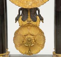 A Charles X Gilt Bronze Mounted Ebonized Portico Clock