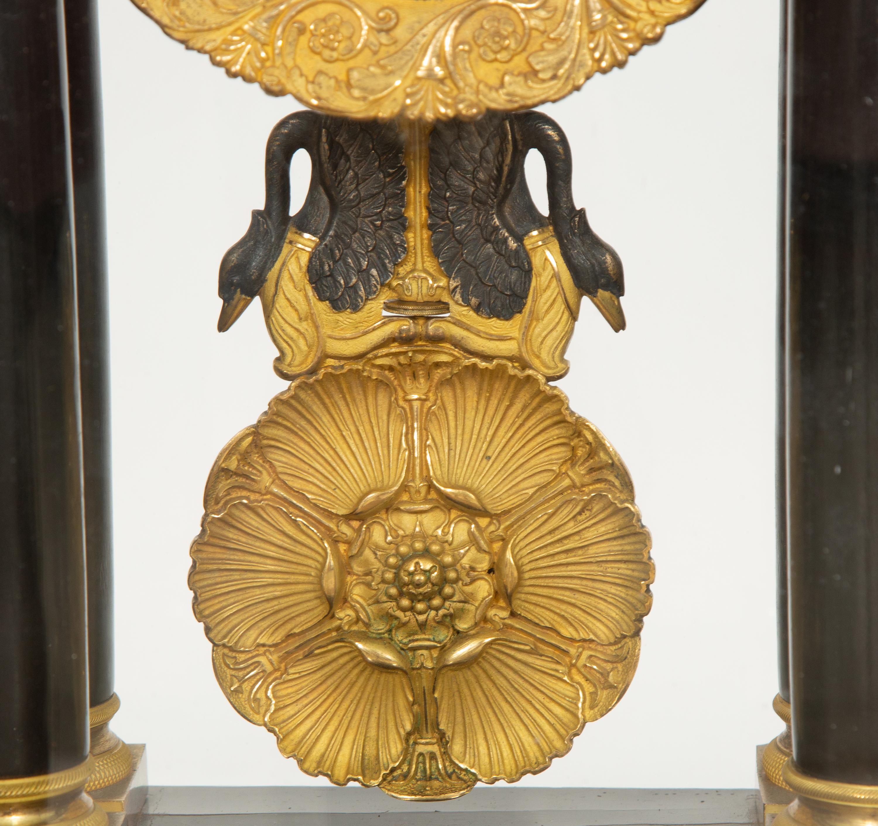 A Charles X Gilt Bronze Mounted Ebonized Portico Clock