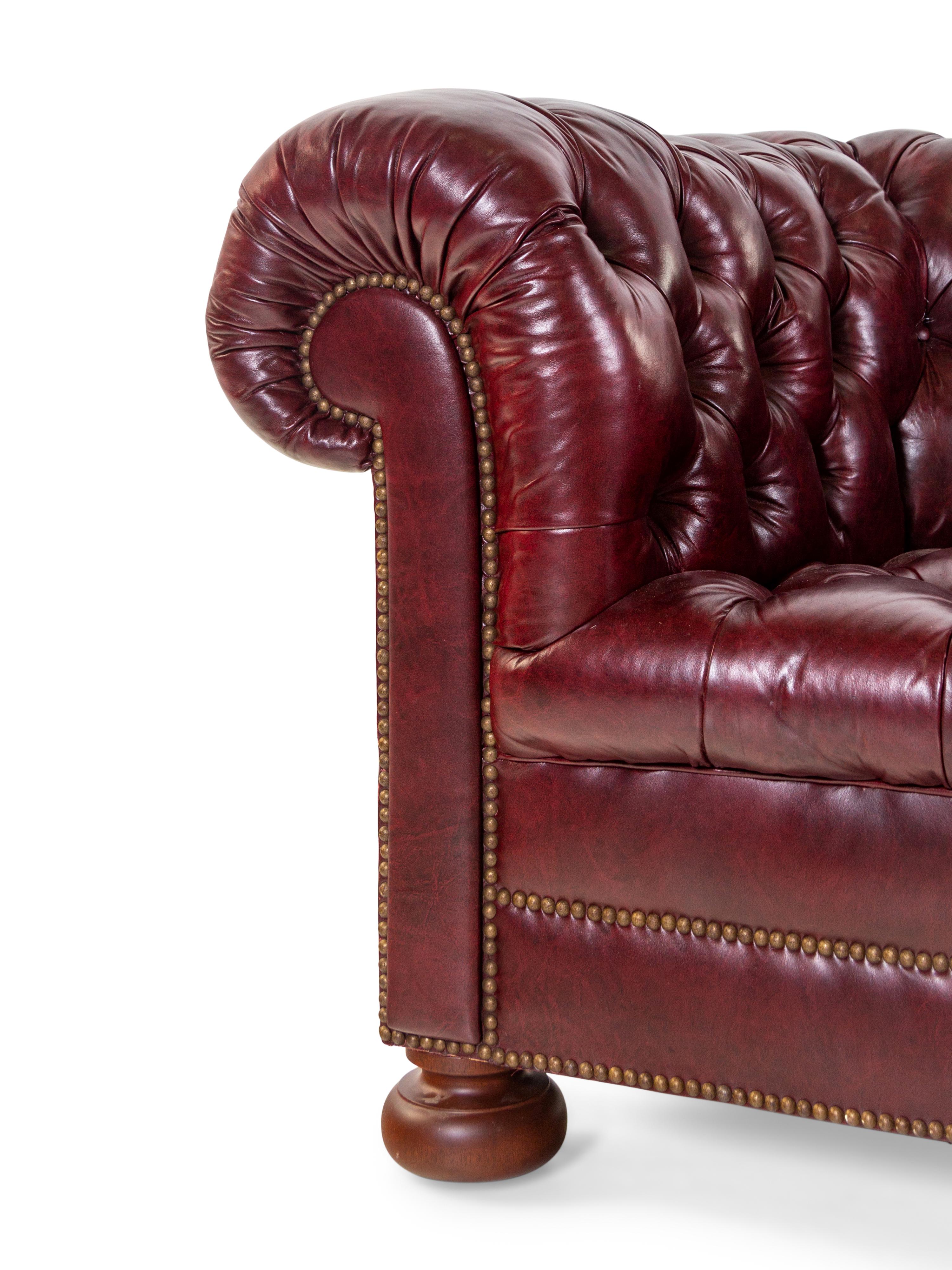 A Tufted Faux Leather Upholstered Chesterfield Sofa