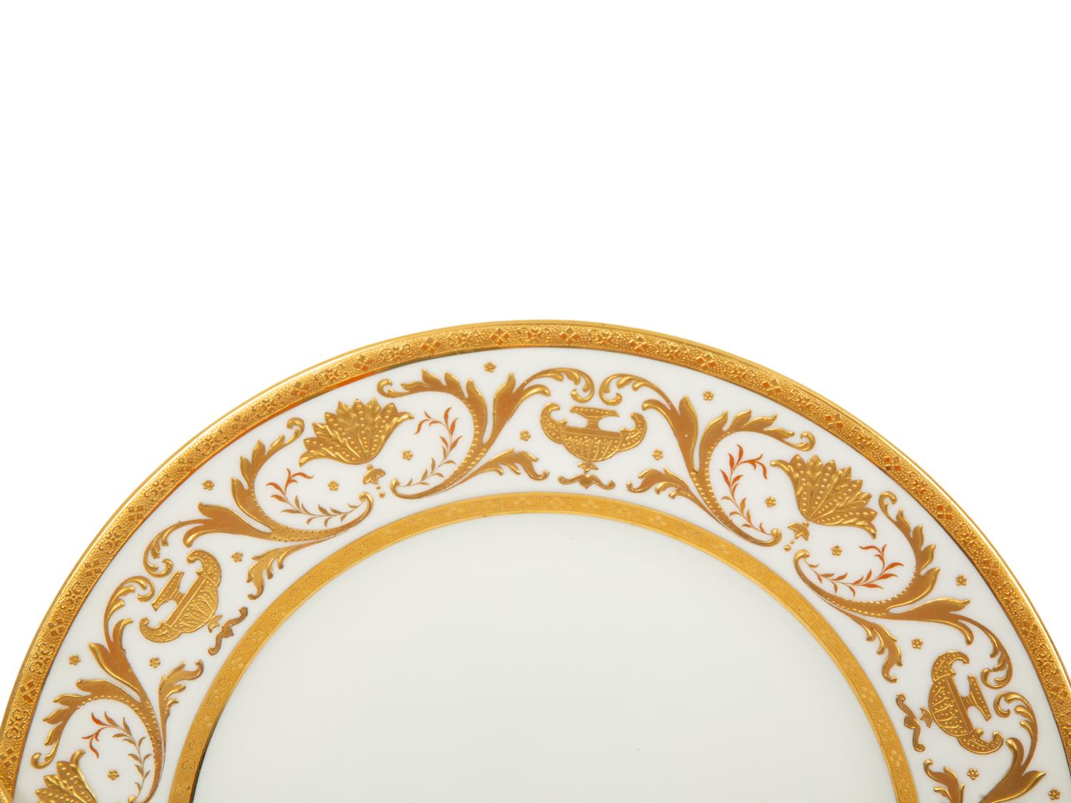 Two Sets of Gilt Decorated Porcelain Dinner Plates