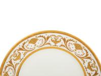 Two Sets of Gilt Decorated Porcelain Dinner Plates