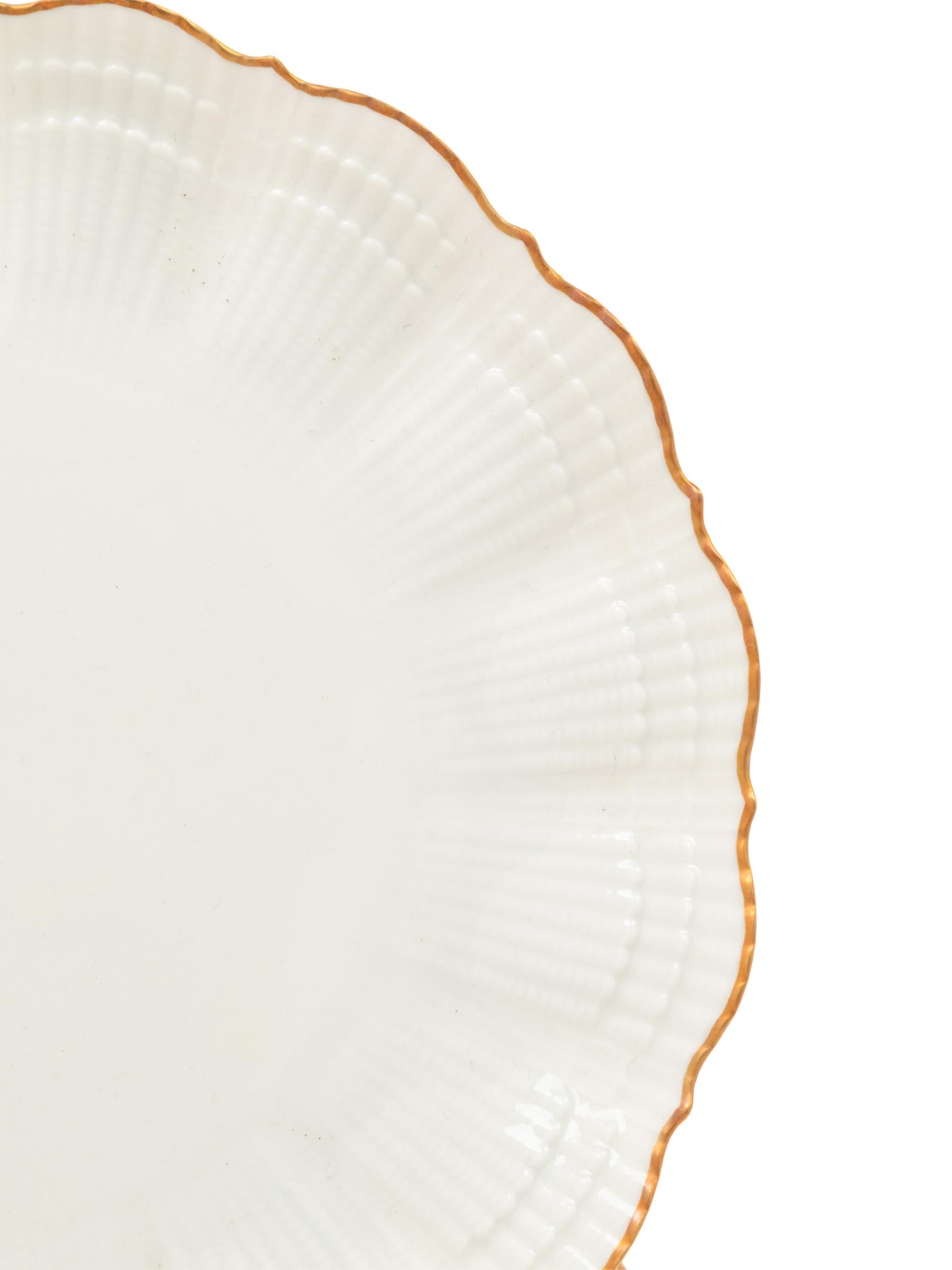 A Set of Twelve Limoges Salad Plates