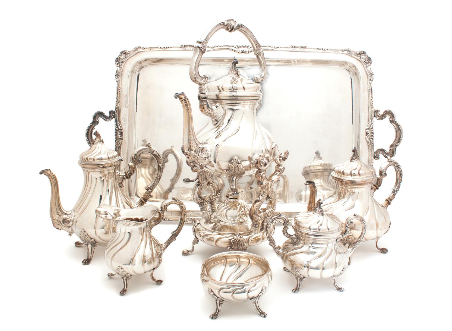 A Peruvian Silver Tea and Coffee Service, Camusso Height of first over handles 18 1/2 inches. — 20TH CENTURY