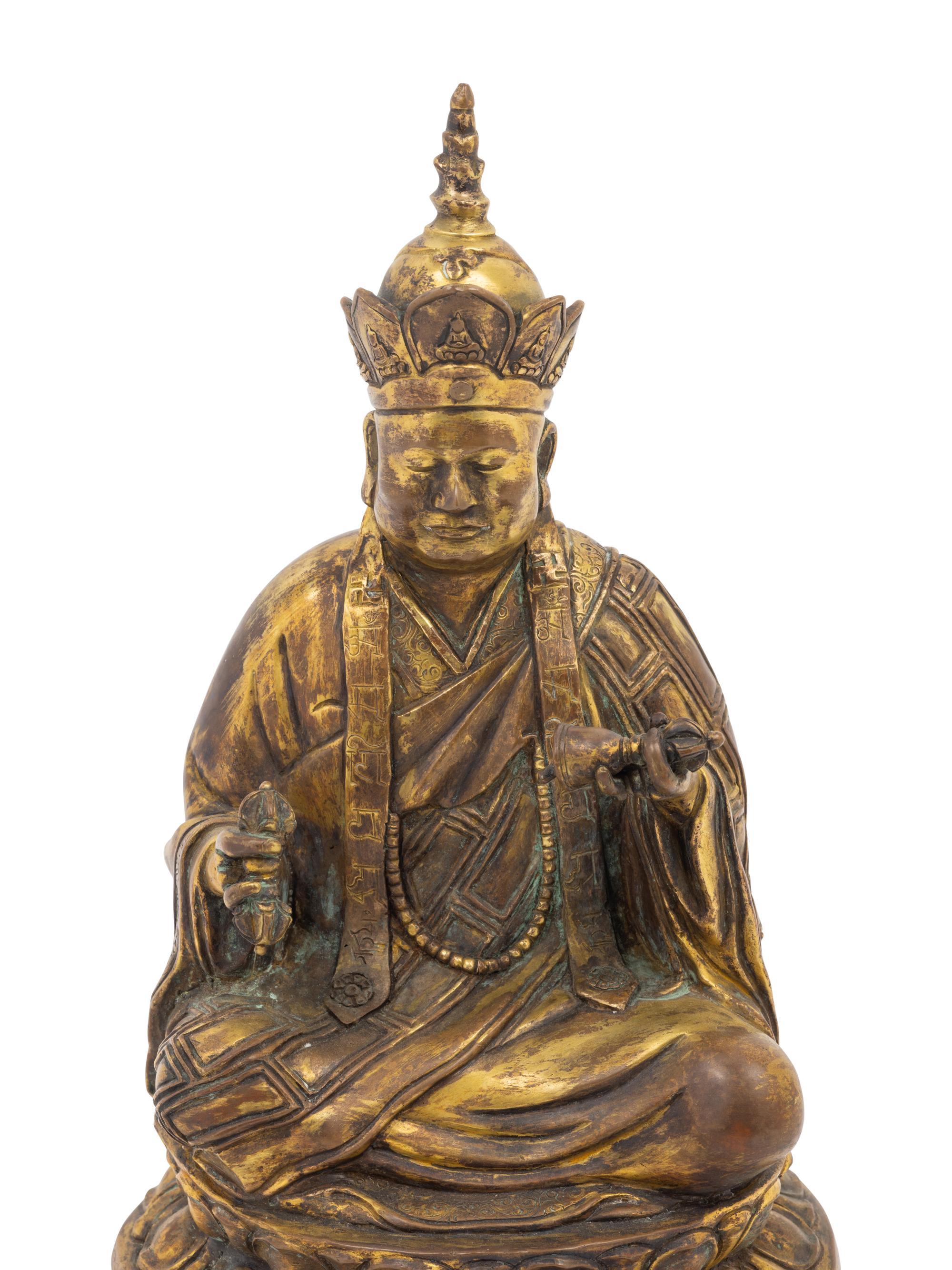 A Tibetan Gilt Bronze Figure of a Seated Guru