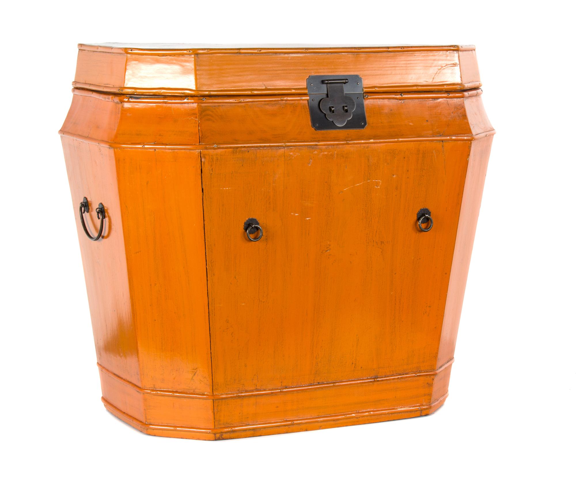 A Large Orange Painted Hinged Top Trunk with Metal Mounts Height 22 3/4 x length 25 1/2 inches.