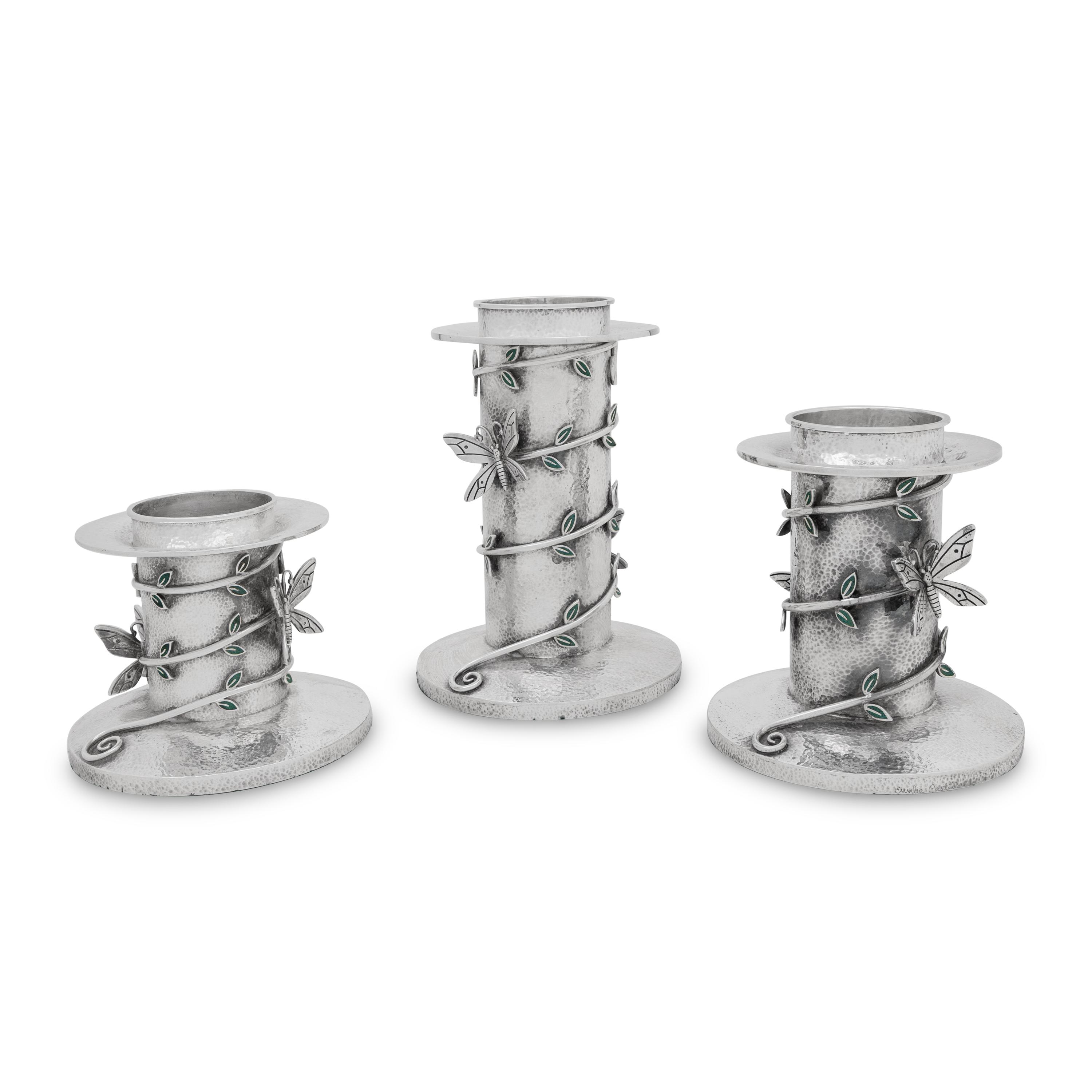 A Set of Three Mexican Silver Graduated Candlesticks