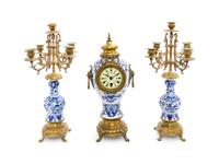 A Delft Pottery Three-Piece Clock Garniture