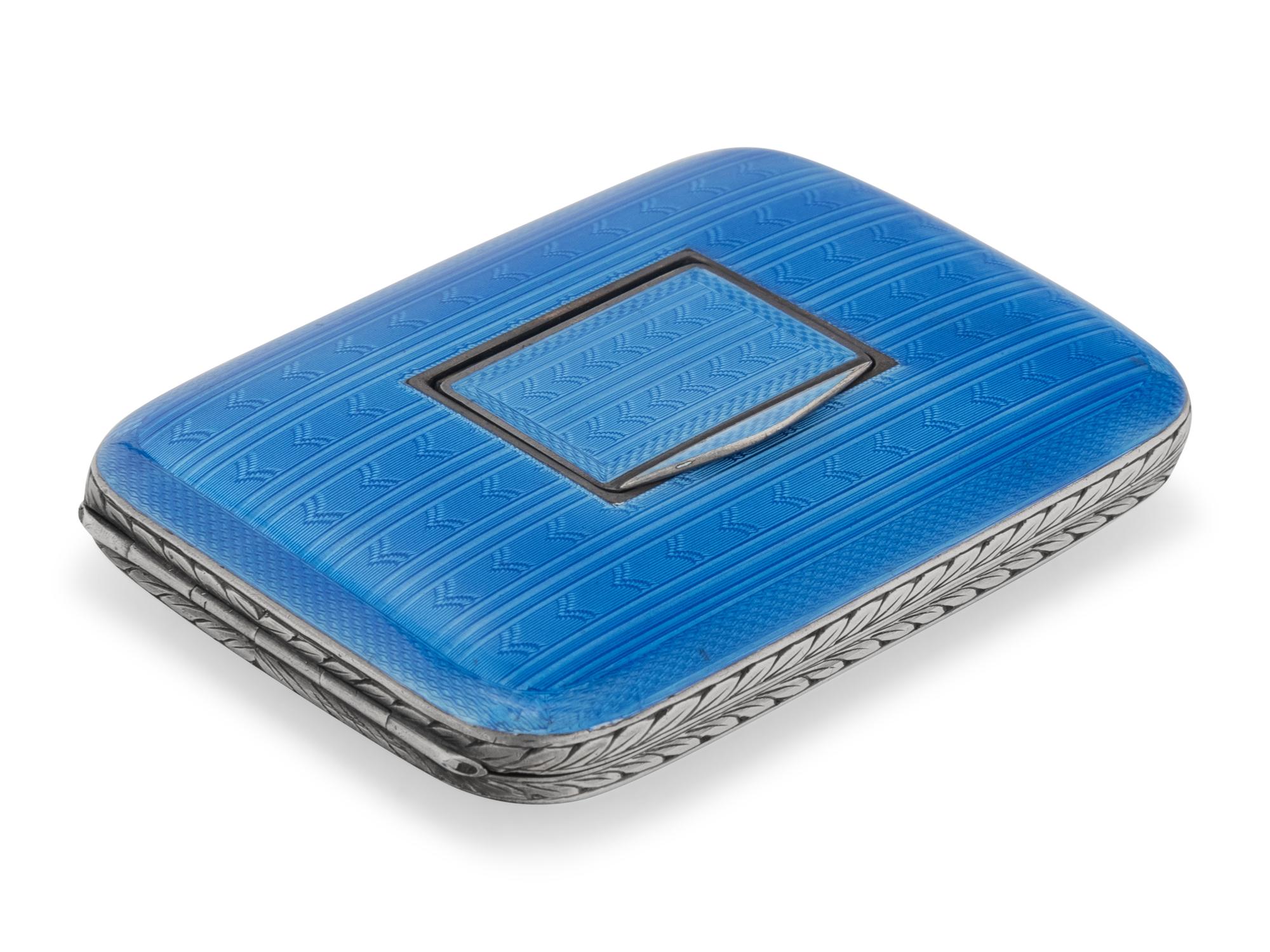 A Swiss Guilloche Enameled Silver and Clock-Inset Cigarette Case